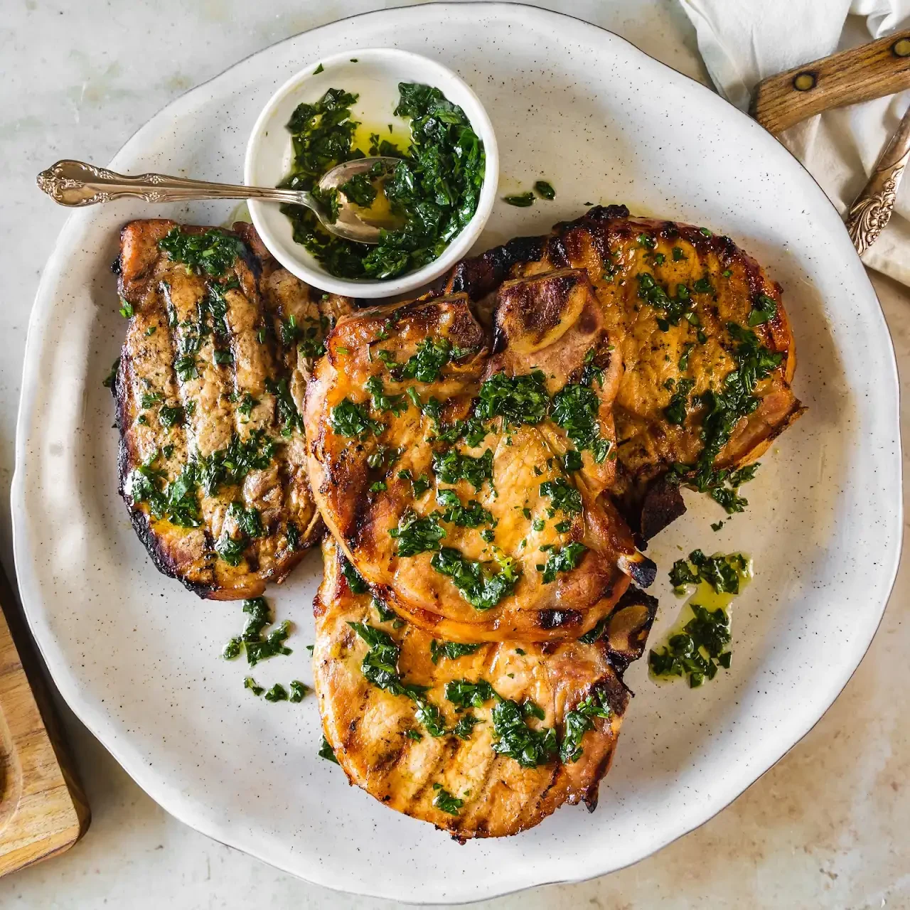 Grilled Orange and Smoked Paprika Brined Pork Chops with Basil Chimichurri