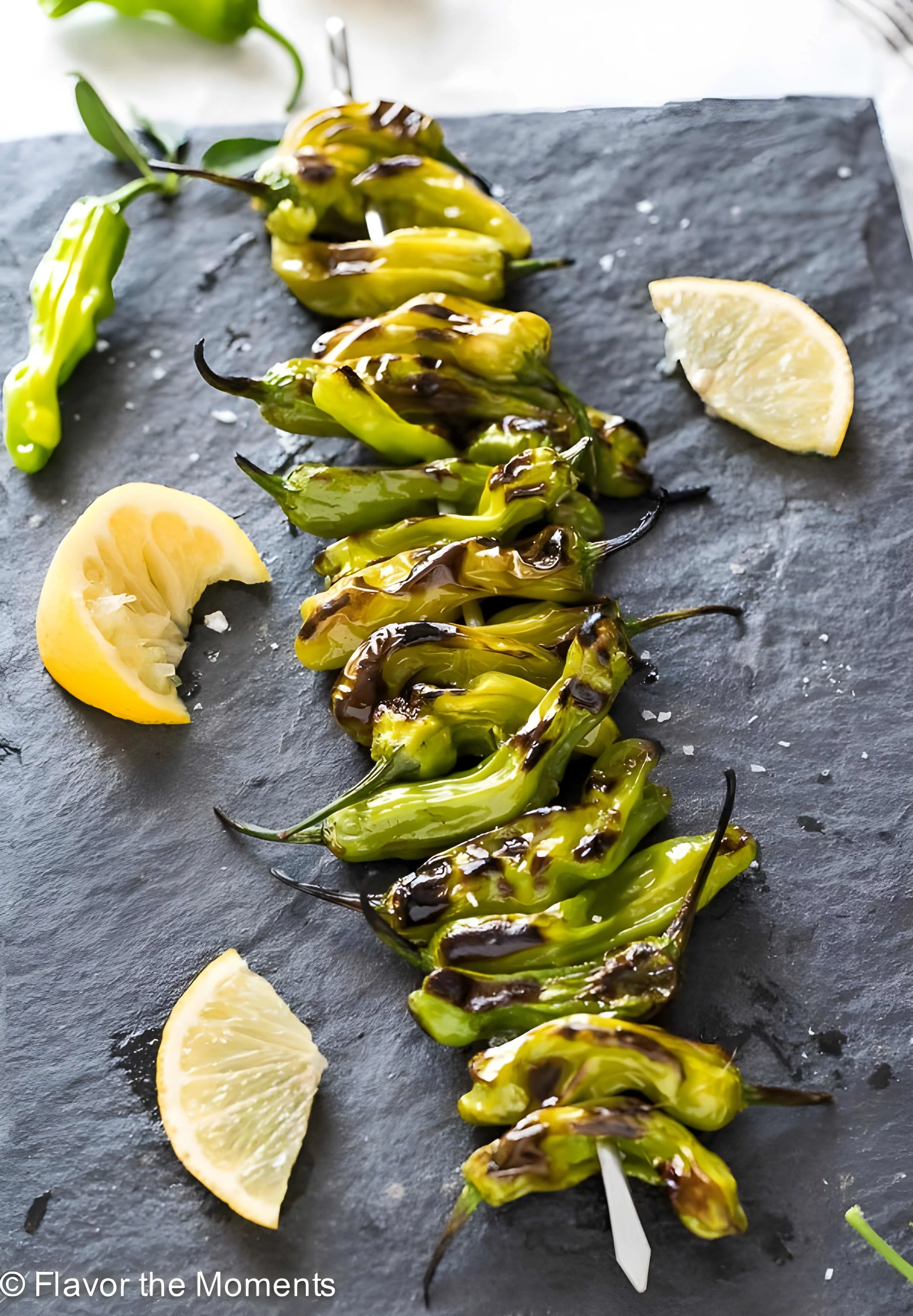 Grilled Shishito Peppers with Lemon and Sea Salt
