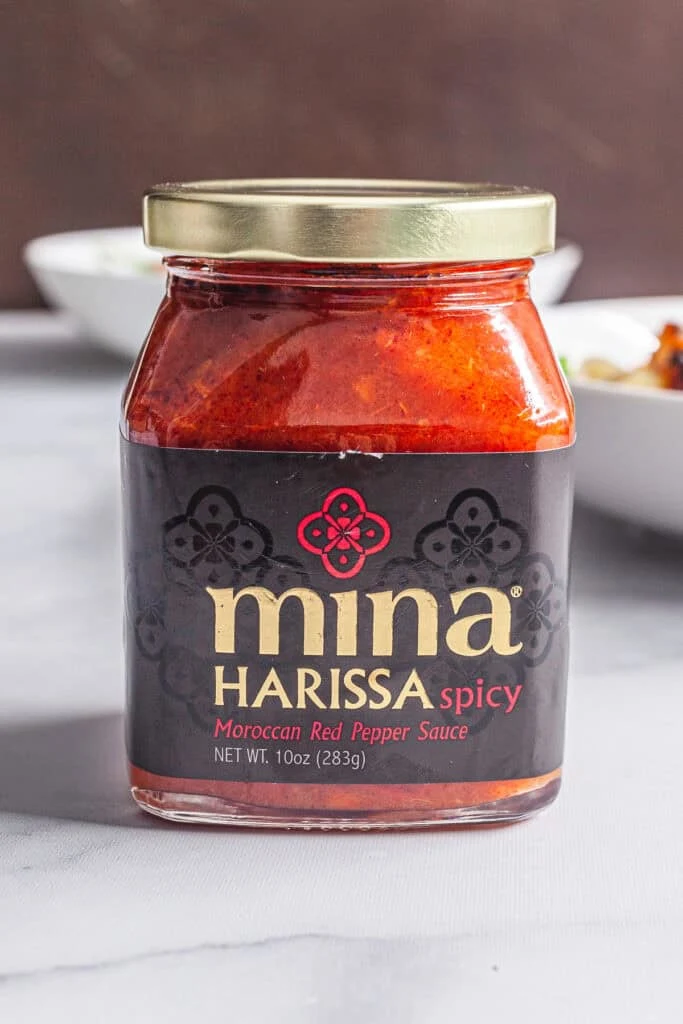 Harissa Roasted Cauliflower and Chickpeas with Tahini Sauce 