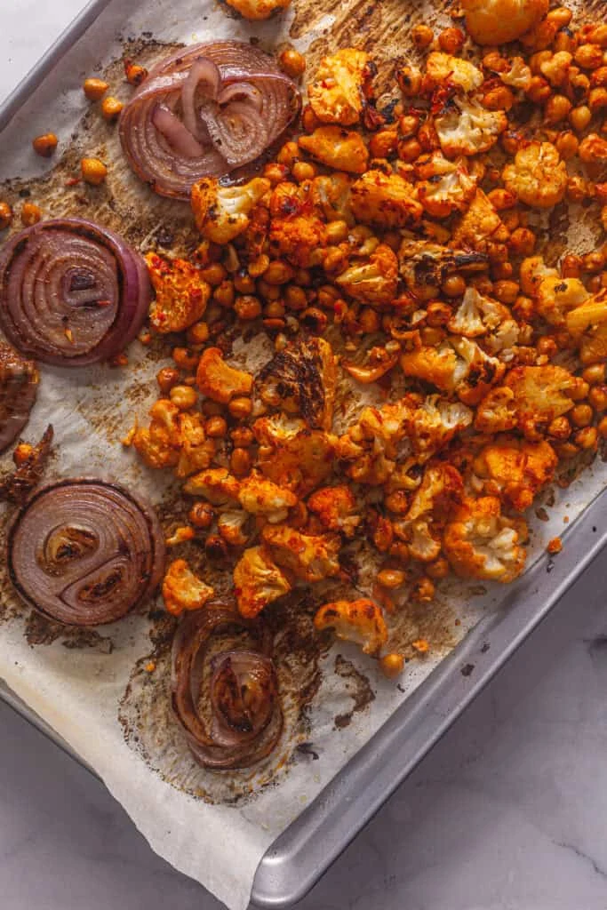 Harissa Roasted Cauliflower and Chickpeas with Tahini Sauce 