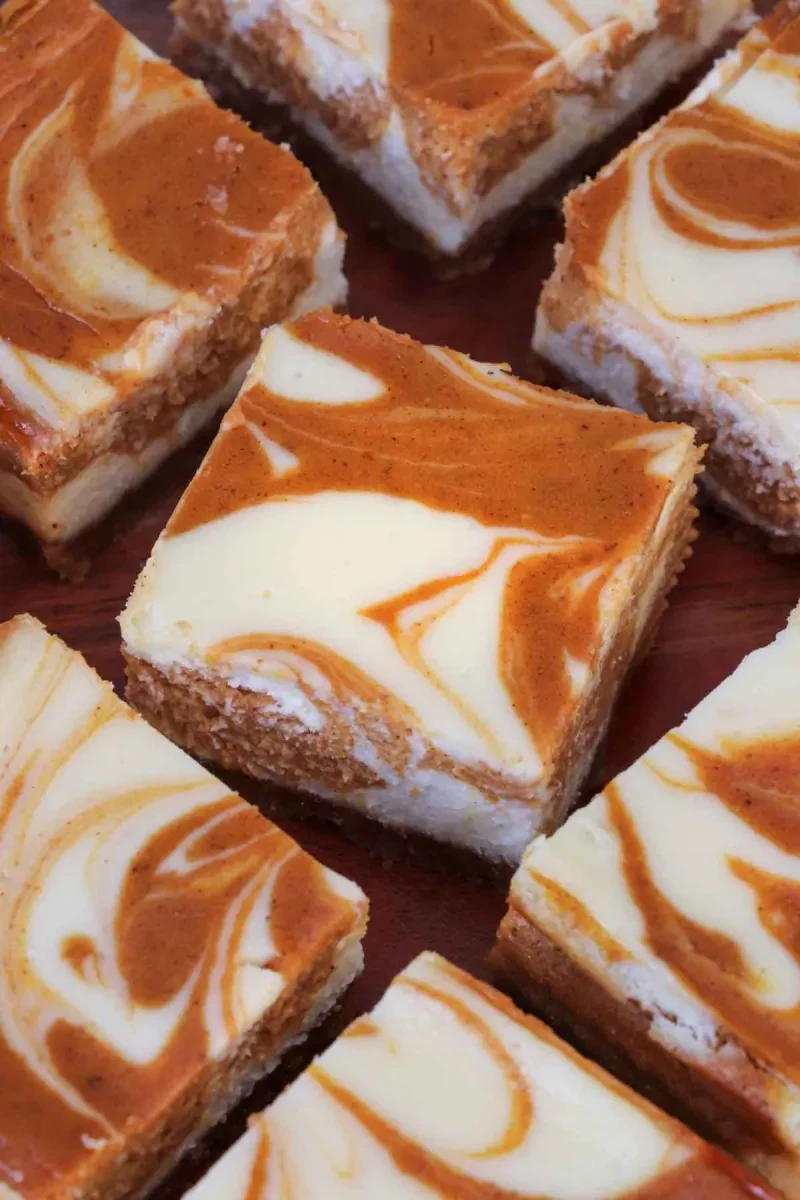 The Best Pumpkin Swirl Cheesecake Bars