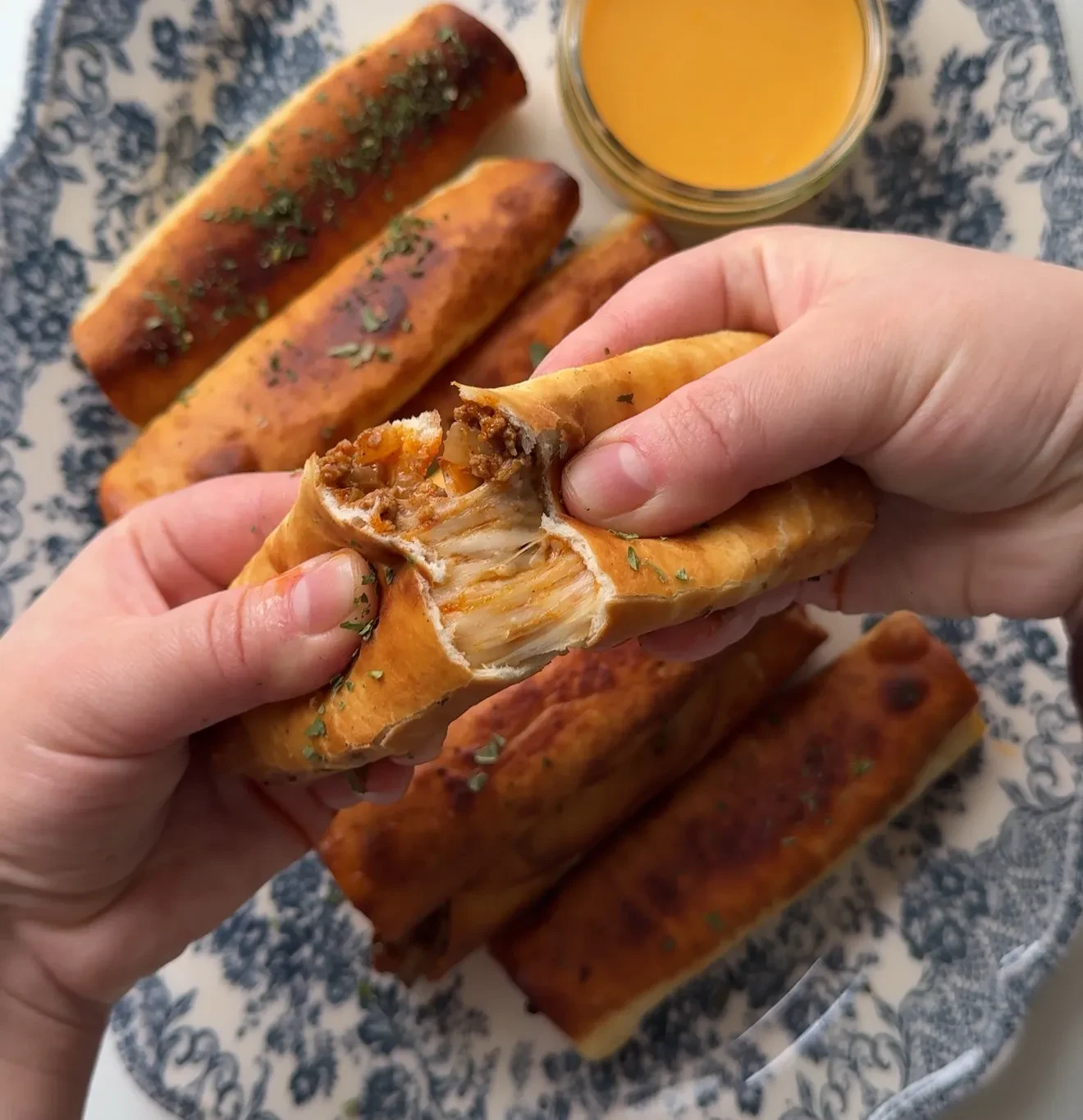 Cheesy Beef Taquitos with Cheddar Sauce