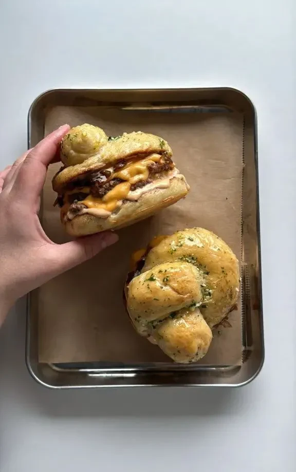 Garlic Knot Double Smash Burger with Caramelized Onion and Chipotle Sauce
