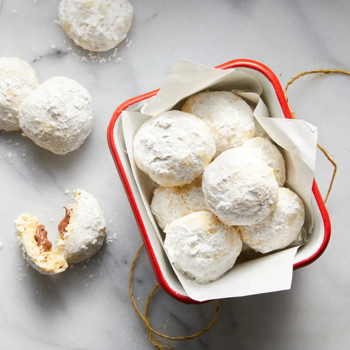 Nutella-Stuffed Hazelnut Snowball Cookies