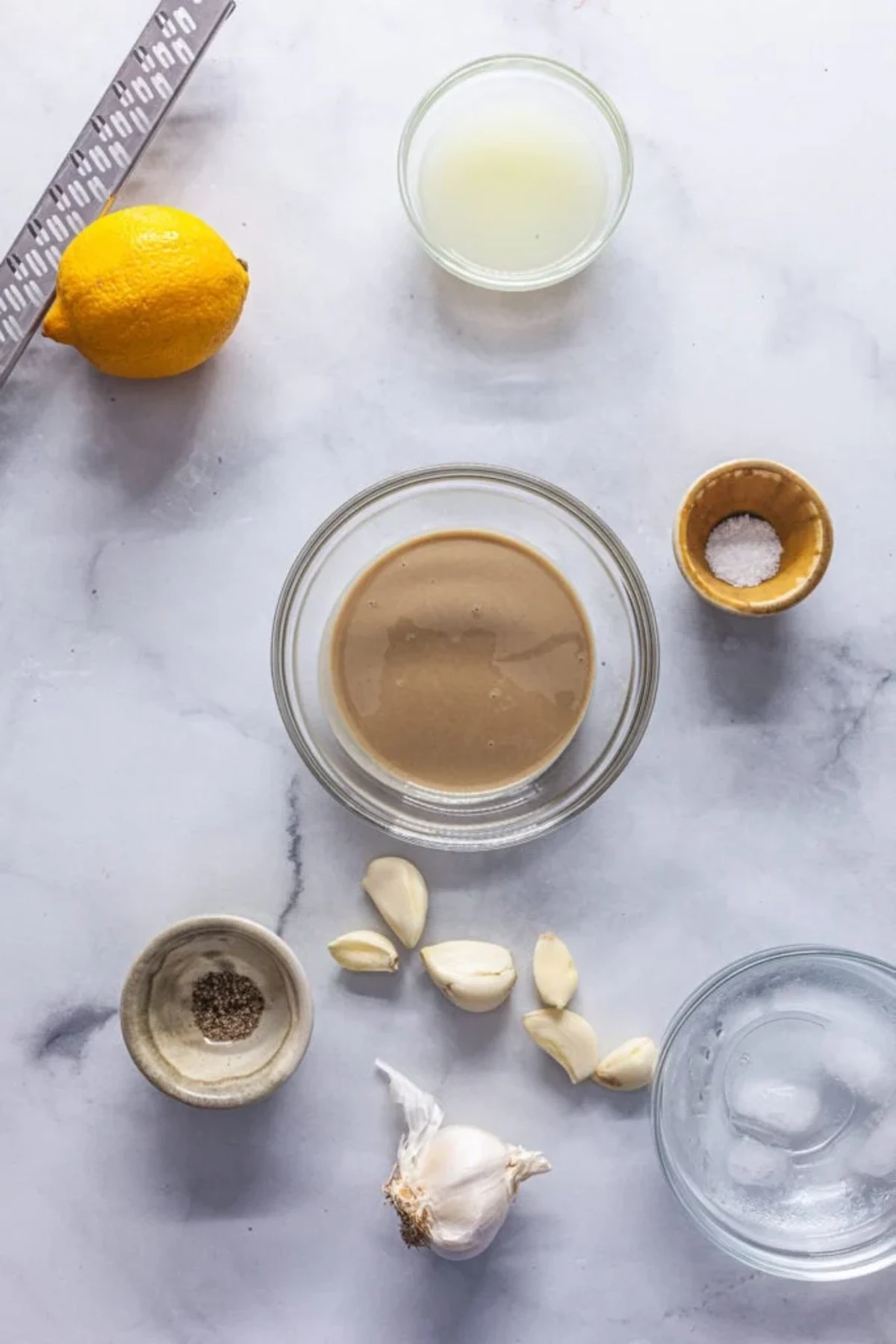 Harissa Roasted Cauliflower and Chickpeas with Tahini Sauce 
