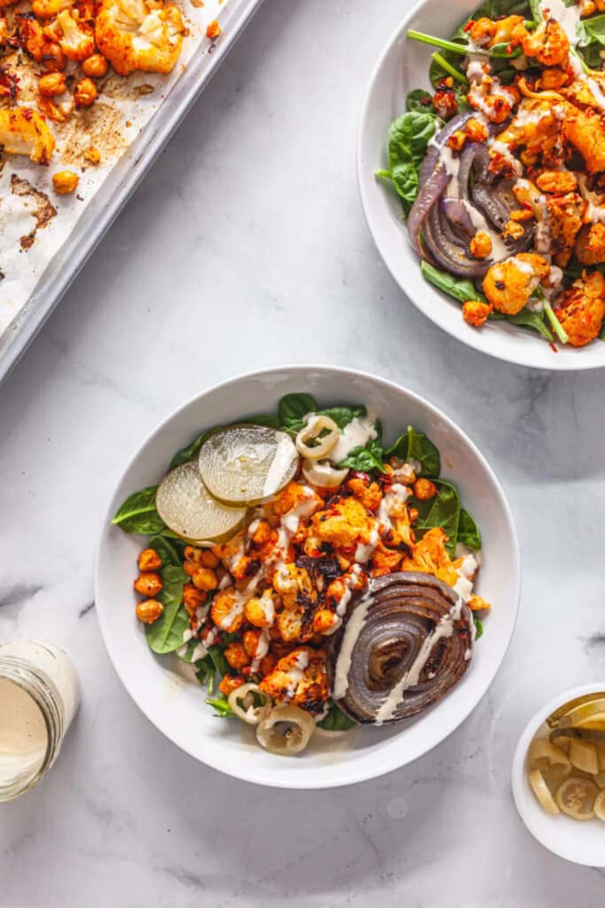 Harissa Roasted Cauliflower and Chickpeas with Tahini Sauce 