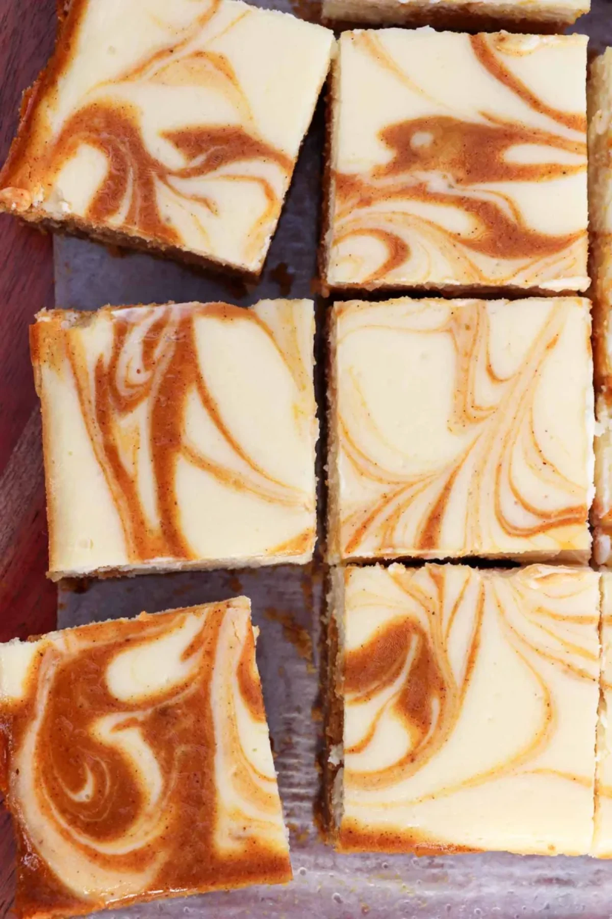 The Best Pumpkin Swirl Cheesecake Bars