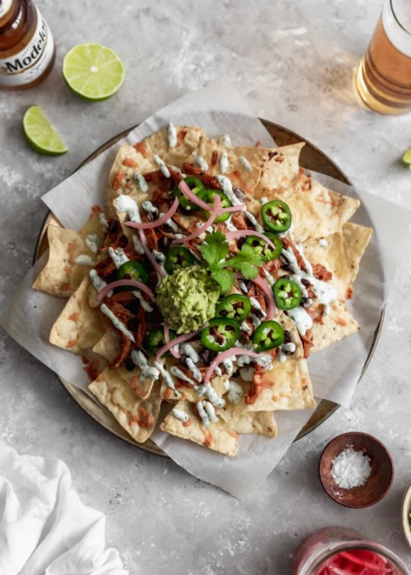 BBQ Chicken Nachos With Cilantro-Lime Crema cover